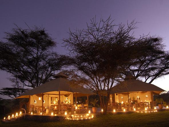 Joy's Camp - lodge exterior at night
