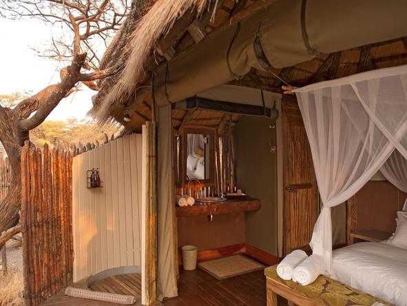 Onguma Tree-Top Camp - bedroom + deck
