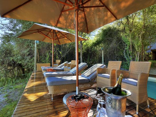 Savute Safari Lodge - pool deck with sunloungers