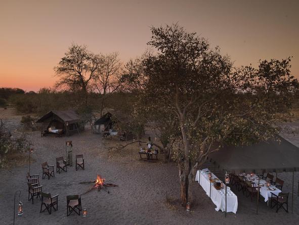 Chobe Under Canvas - outdoor dining + campfire