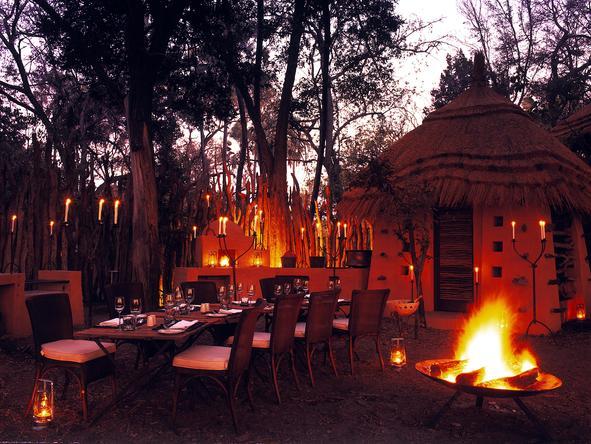 Chobe Under Canvas - staff laying table