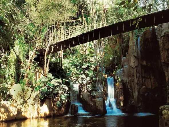Cascades Hotel - swing bridge over the river