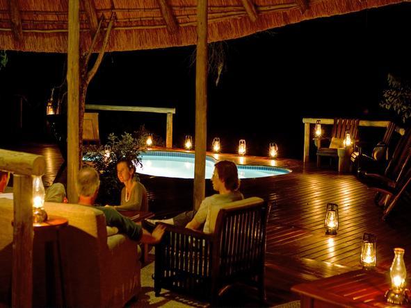 Kwando Lagoon Camp - lounge at night 