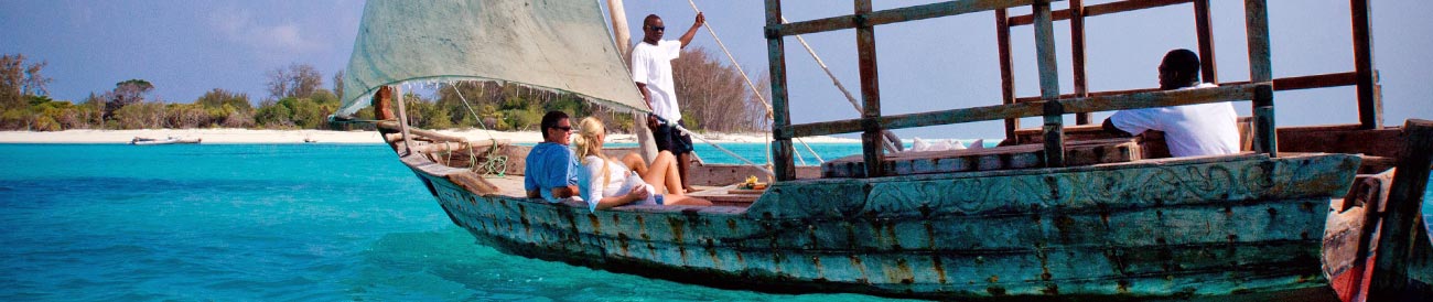 Zanzibar Honeymoon - white-sailed dhows & a sapphire sea are just part of your romantic Indian Ocean adventure.