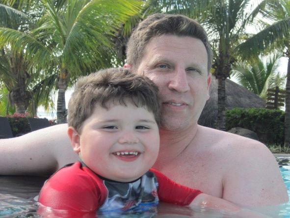 Jason Sheldon - swimming with his son at Le Victoria in Mauritius