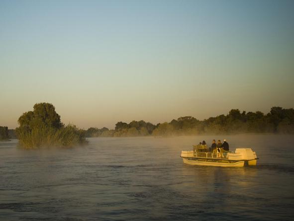 Discover the quieter side of the Zambezi, with a boat cruise upstream of Victoria Falls.