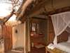 Onguma Tree-Top Camp - bedroom + deck